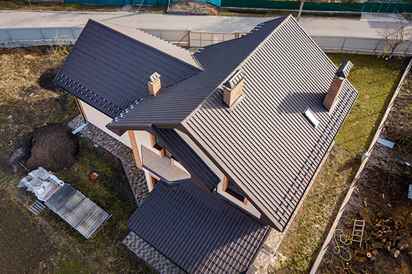 An aerial view of a home with a slate roof.