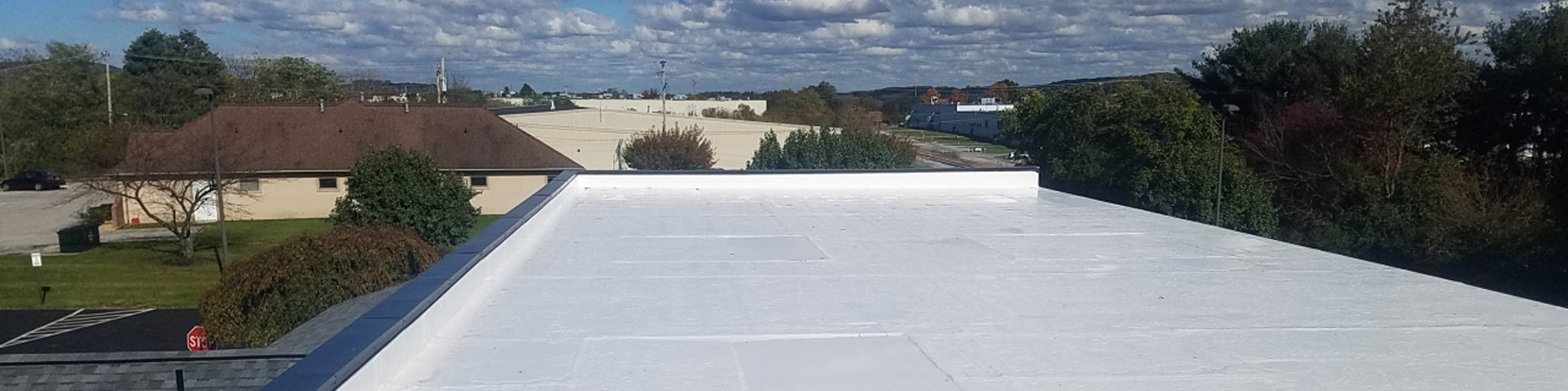 flat commercial roof with coating
